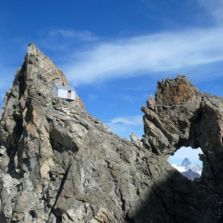 A Cabin For Mountaineers Sits Amongst The Peaks Of The Italian Alps ...