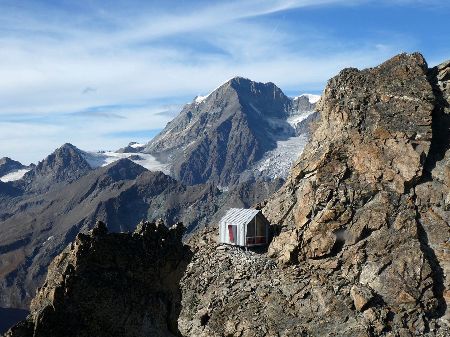 A Cabin For Mountaineers Sits Amongst The Peaks Of The Italian Alps ...