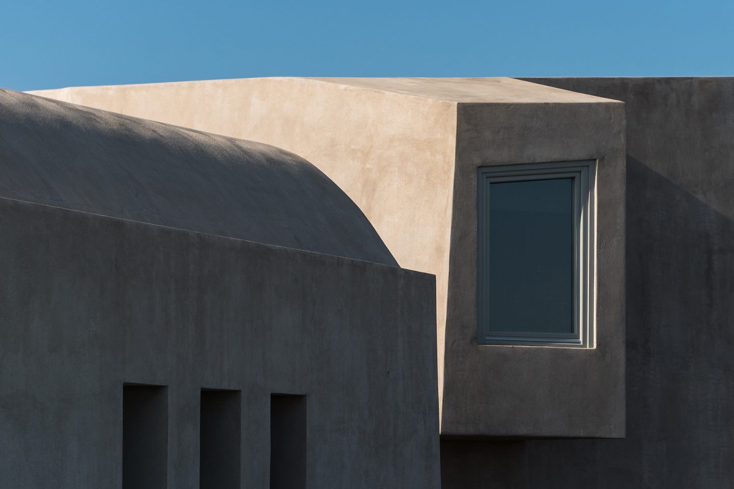 A Monolithic Hilltop Residence In Santorini Is Rooted To Its Historic 